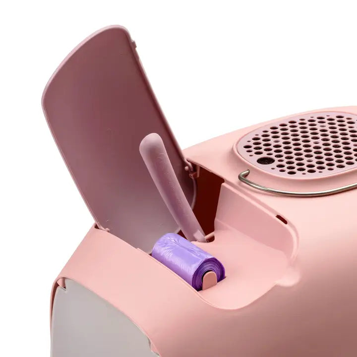 Designer Katzenklo mit Deckel, Filter und Reinigungszubehör in rosa.